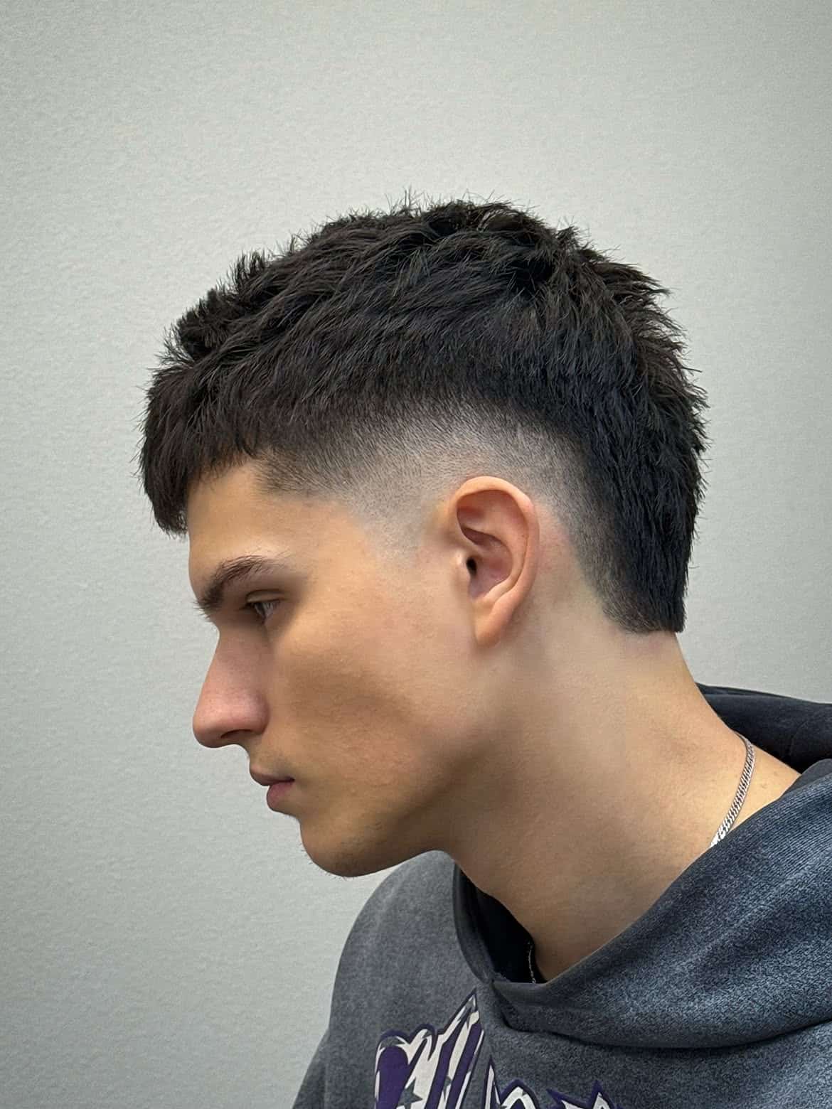 20. Textured Burst Fade Mullet with Cropped Fringe
