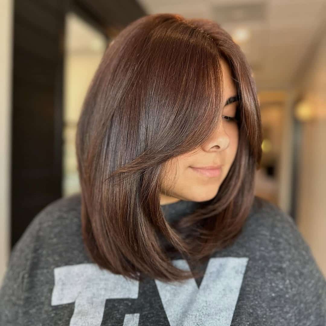 8. Toasted Chestnut Lob with Curtain Bangs