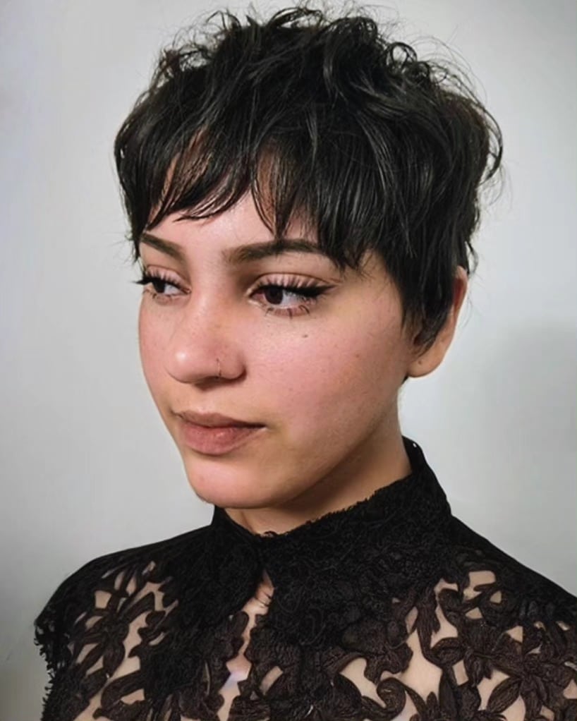 28. Tousled Black Pixie Mullet with Wispy Bangs