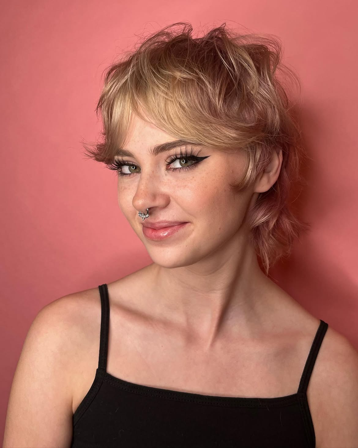 19. Tousled Blonde Shag Mullet with Curtain Bangs