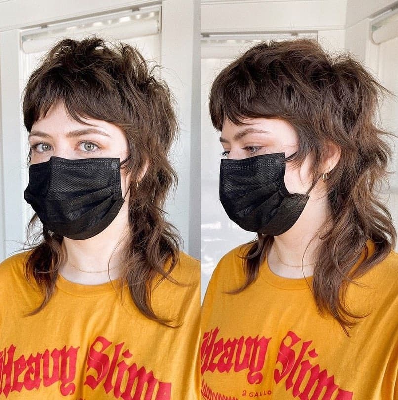 3. Tousled Brunette Shag Mullet with Baby Bangs