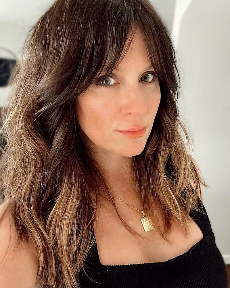 18. Tousled Chestnut Layers with Soft Fringe