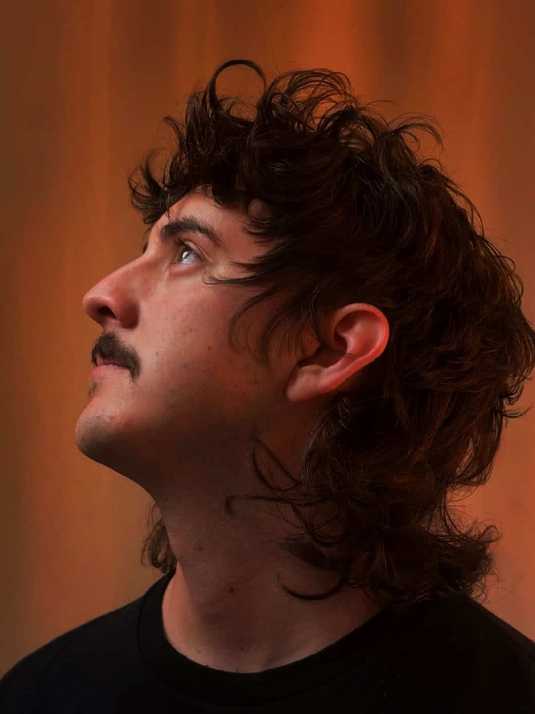 17. Tousled Curly Flow Mullet