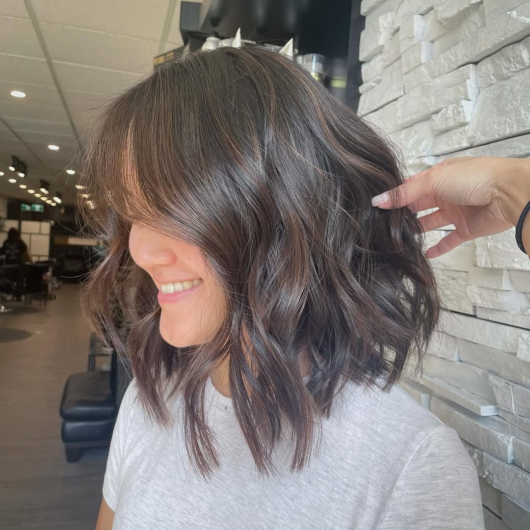 13. Tousled Espresso Lob with Wispy Bangs