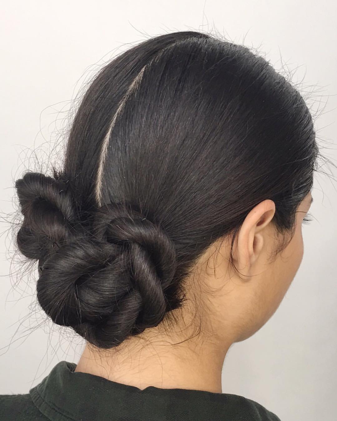 18. Twisted Low Double Bun