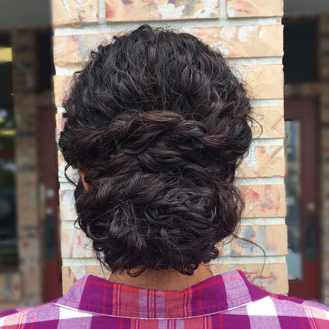 10. Twisted Low Updo for Curly Hair