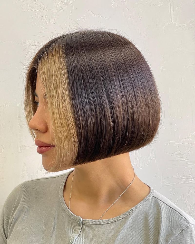 44. Two-Tone Blunt Bob with Face-Framing Blonde Highlights
