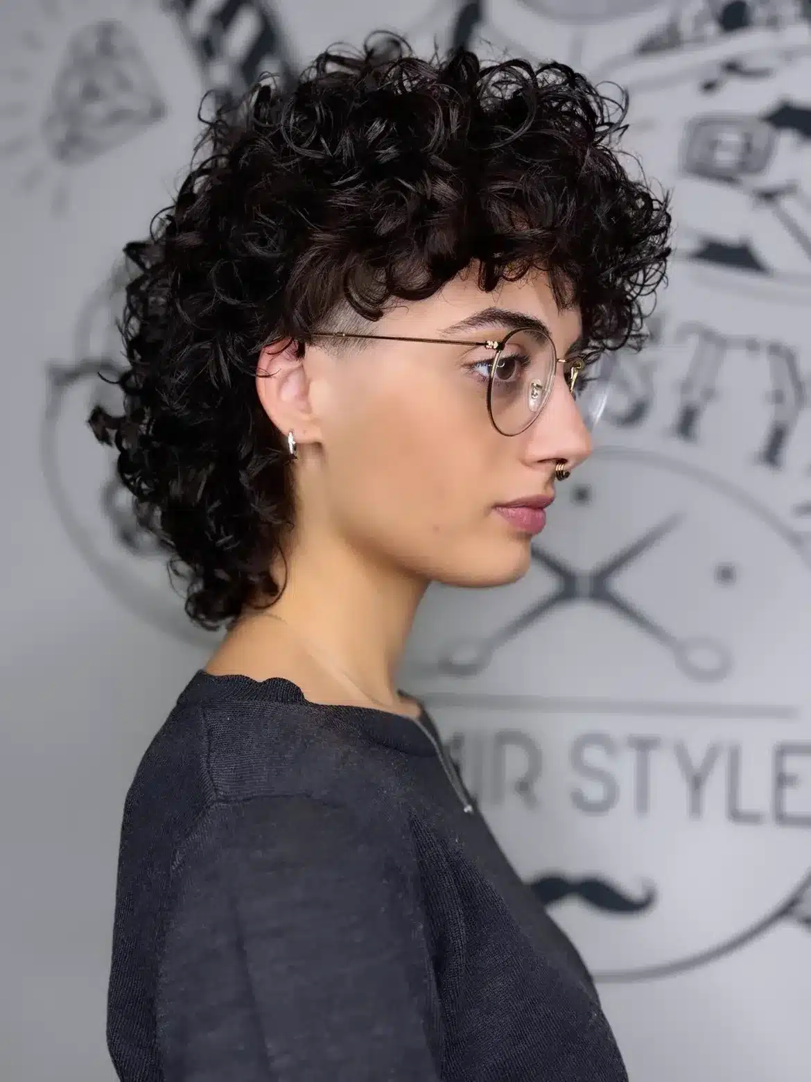 38. Undercut Curly Mullet with Micro Bangs