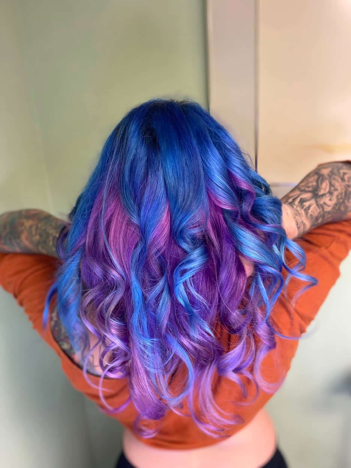 31. Vibrant Blue and Orchid Curls