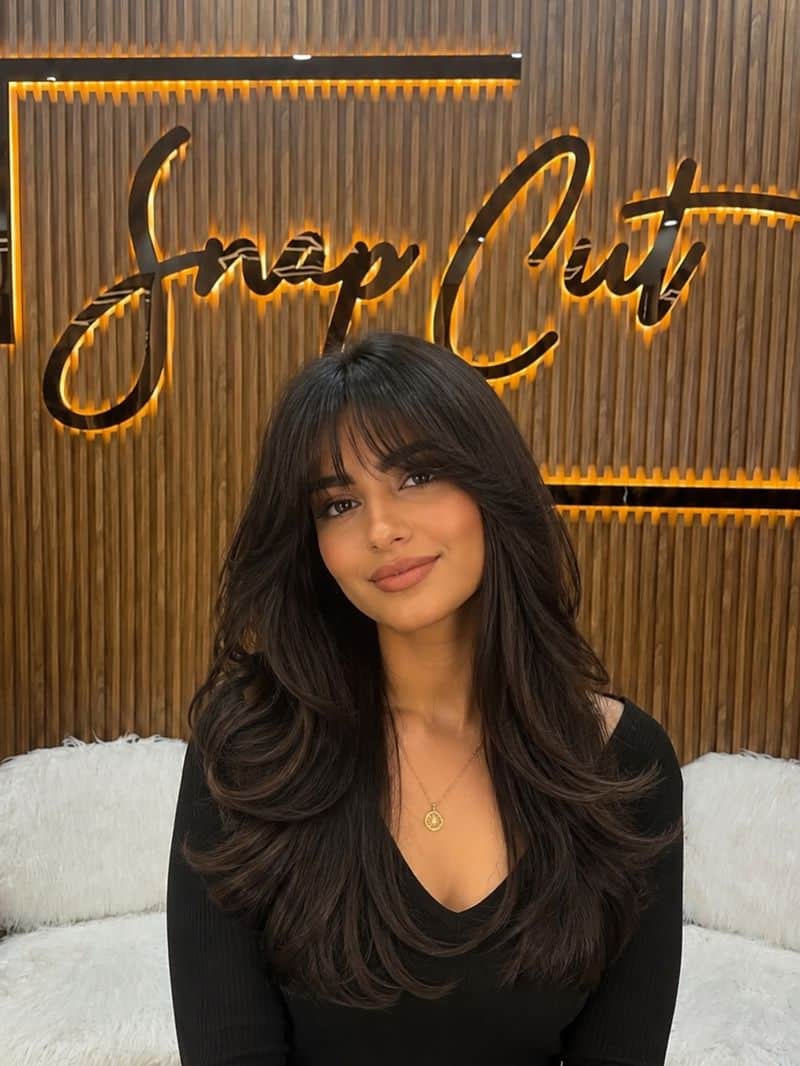 19. Voluminous Layers with Wispy Fringe