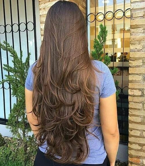 19. Waist-Length Brunette Layers with Curled Ends
