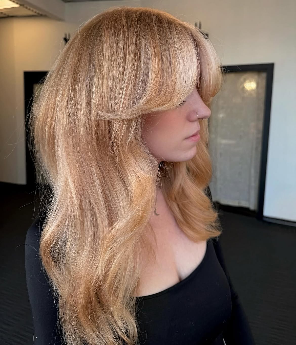7. Warm Honey Curtain Fringe Blowout