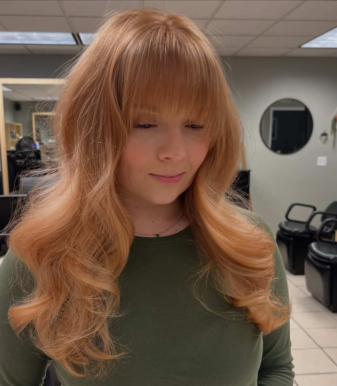 11. Warm Honey and Peach Layers with Bangs