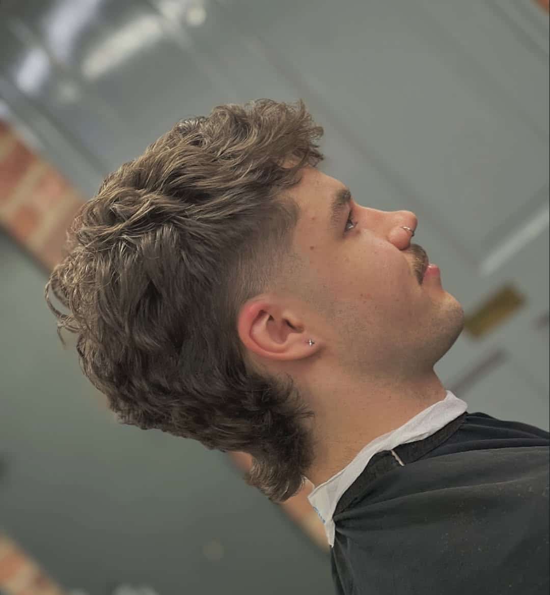 13. Wavy Mullet Fade with Tapered Sides