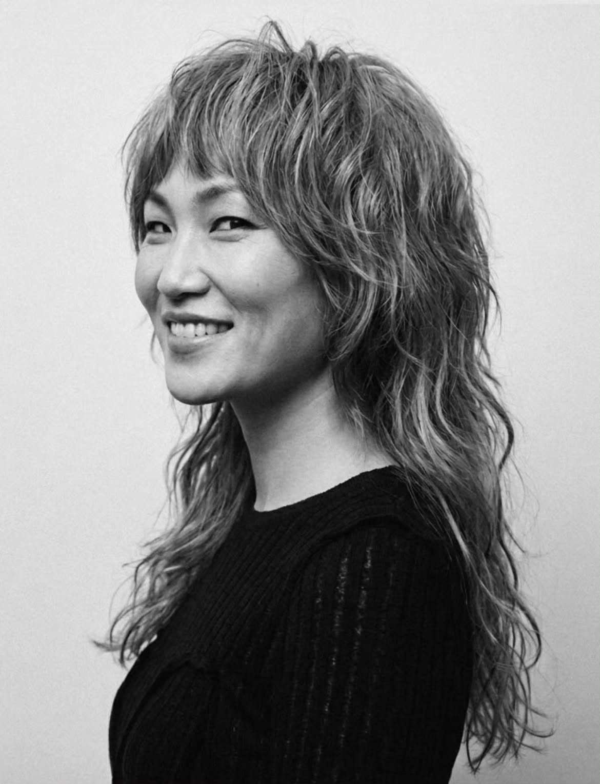 11. Wavy Shag Mullet with Choppy Baby Bangs