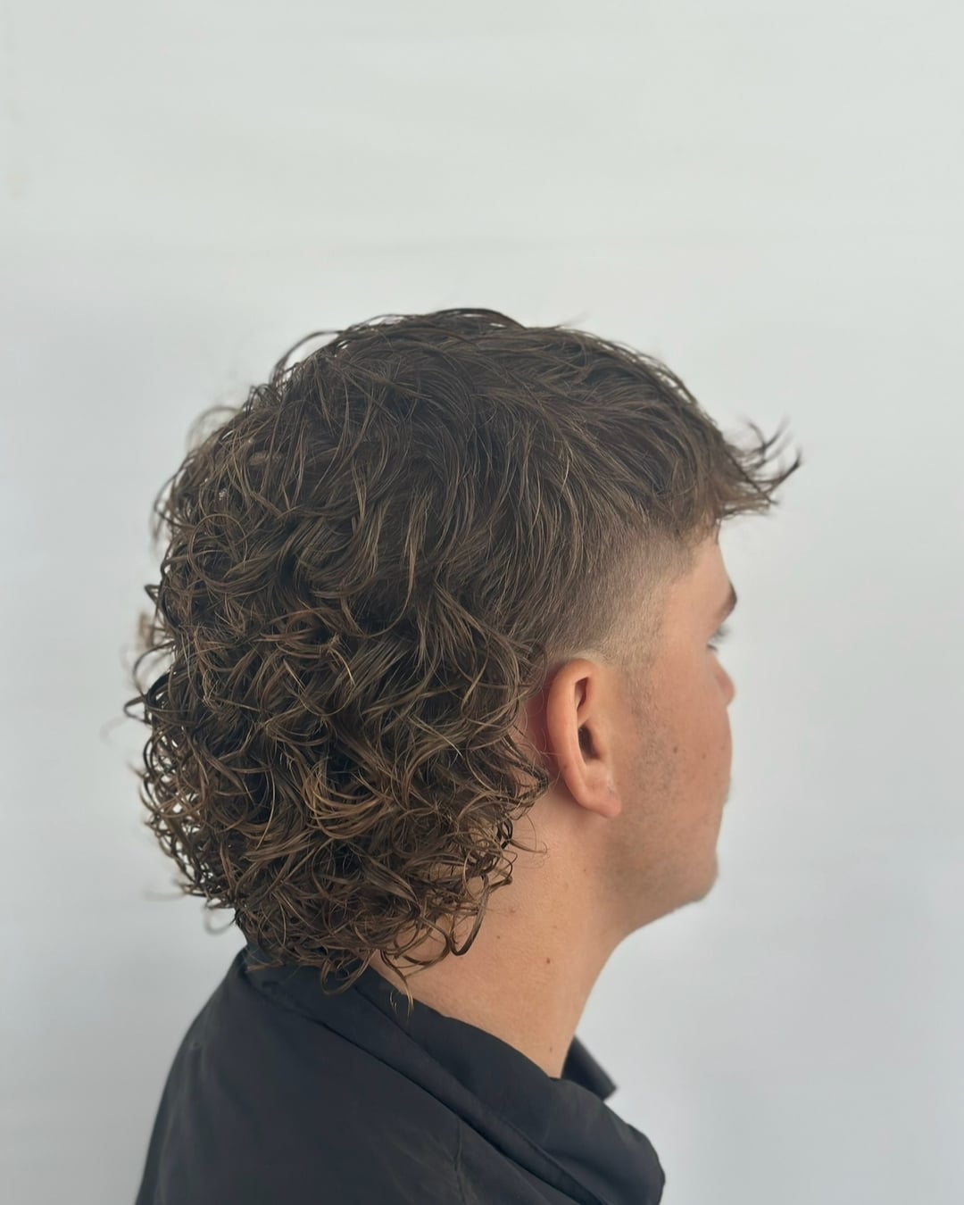 36. Wet-Curl Mullet with Low Taper Fade