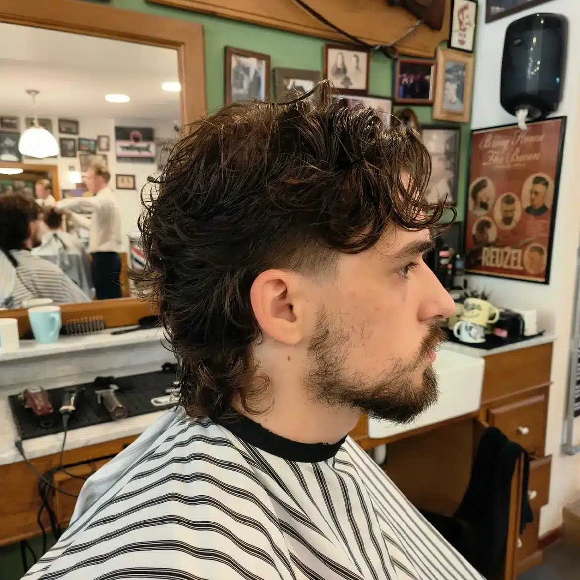 37. Wet-Look Curly Mullet with Low Fade