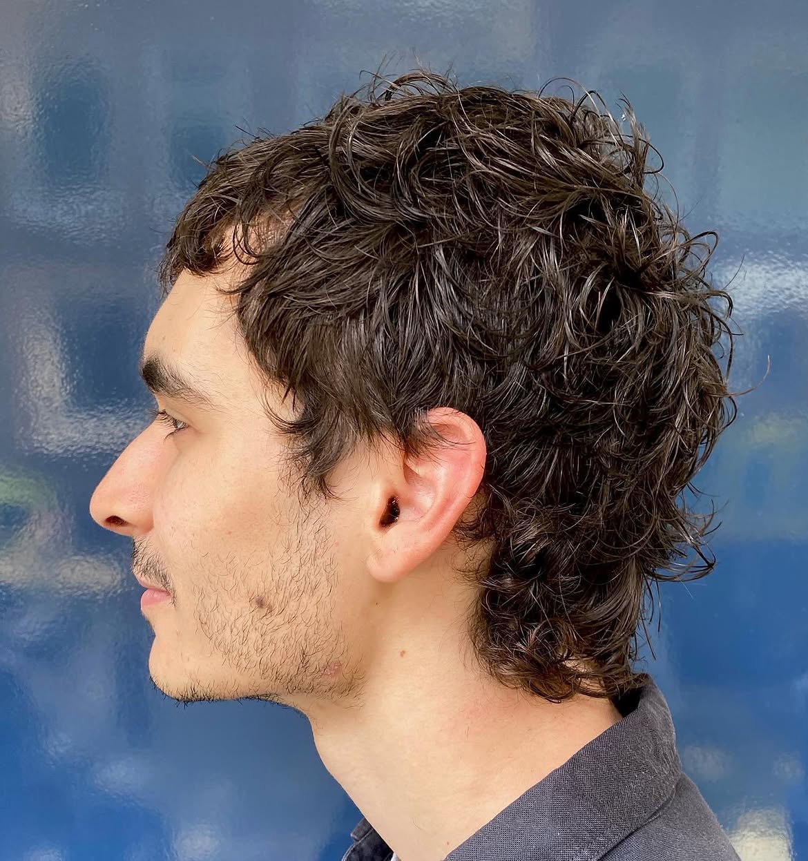 34. Wet-Texture Curly Mullet with Tapered Sides
