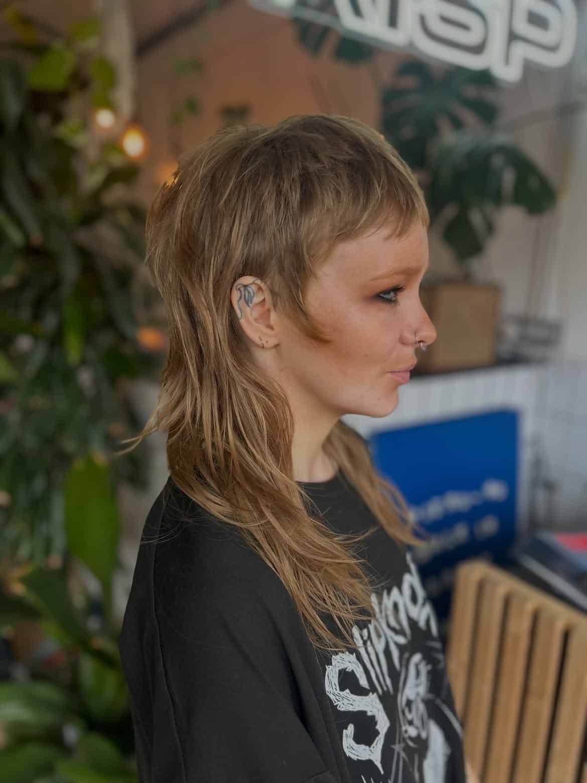34. Wispy Blonde Shag Mullet with Baby Bangs