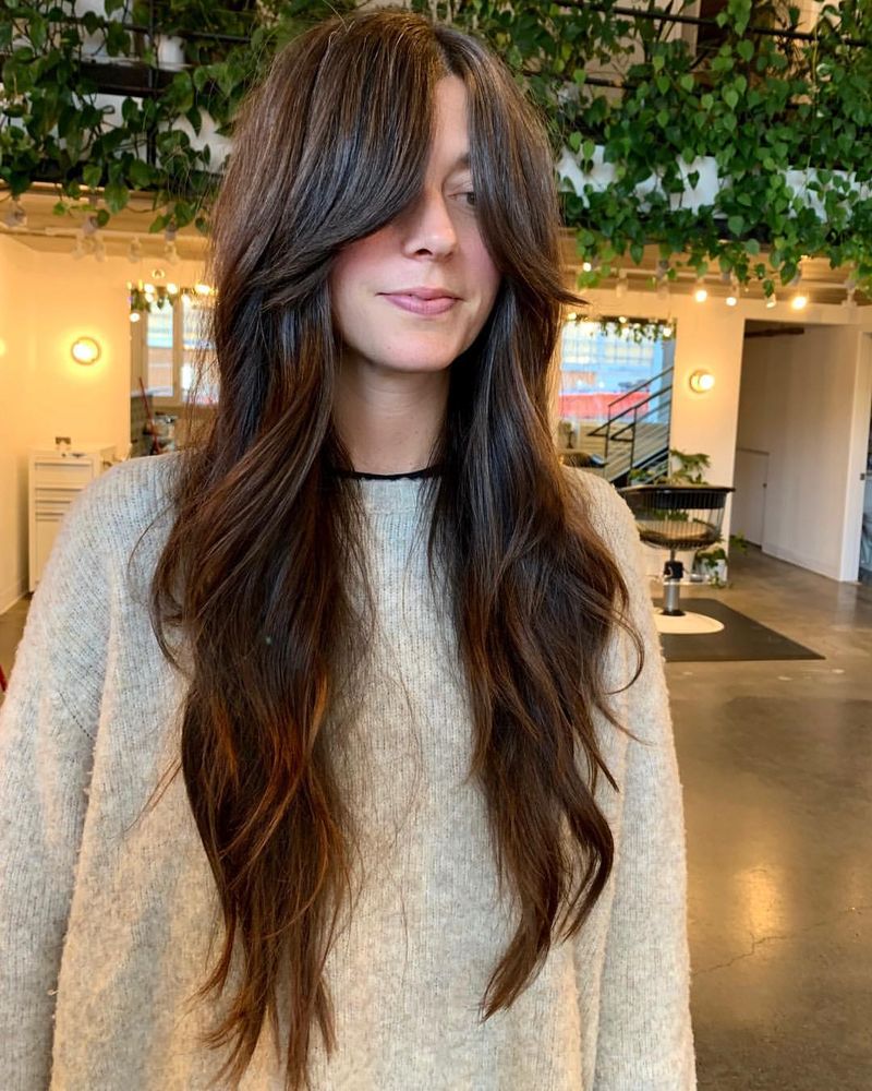 50. 70s-Inspired Layers with Curtain Bangs