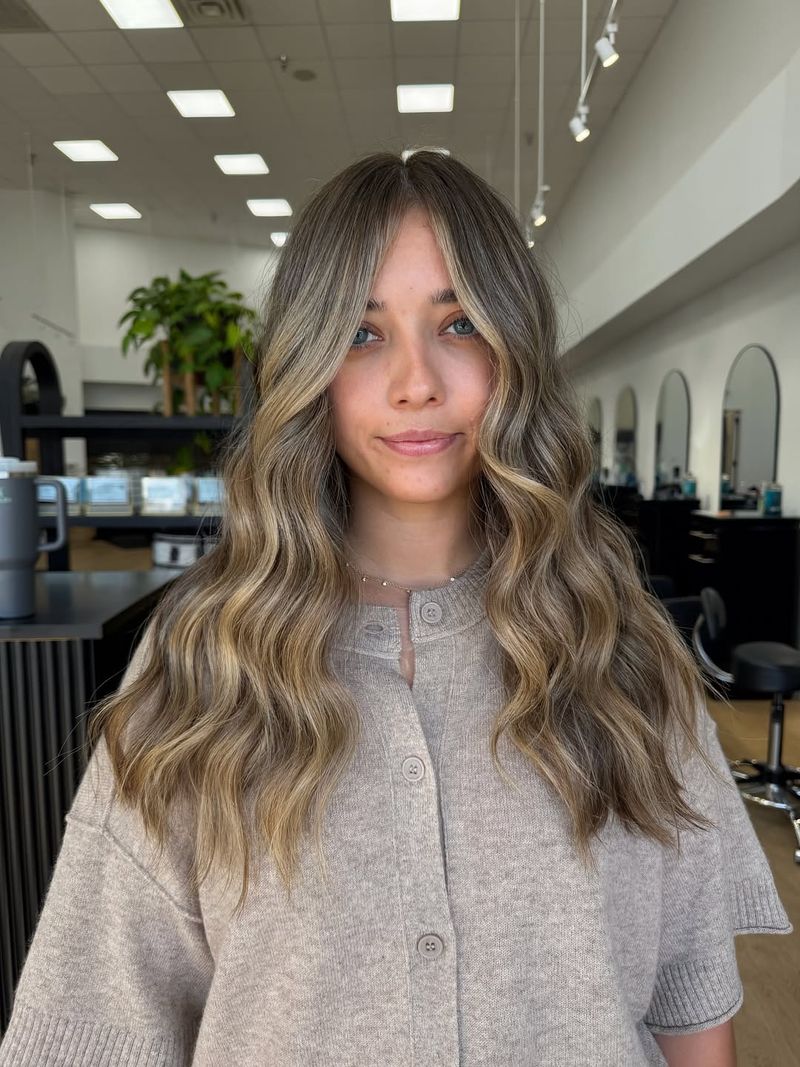 14. Ash Blonde Balayage with Soft Curtain Fringe