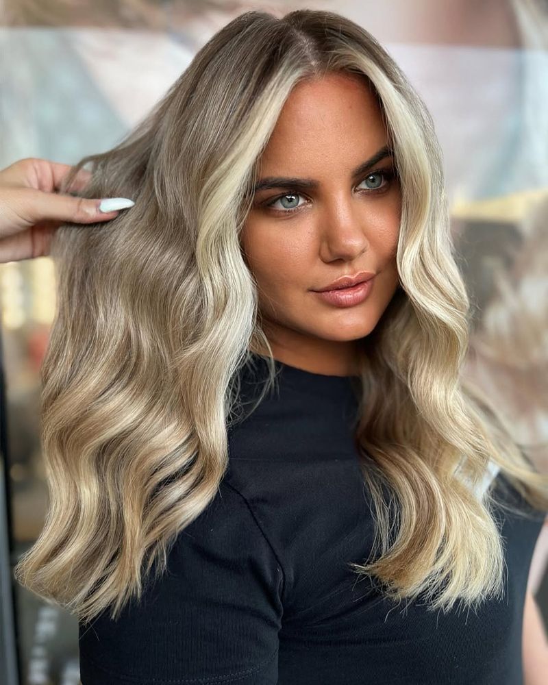 19. Ash Blonde Waves with Bright Money Pieces