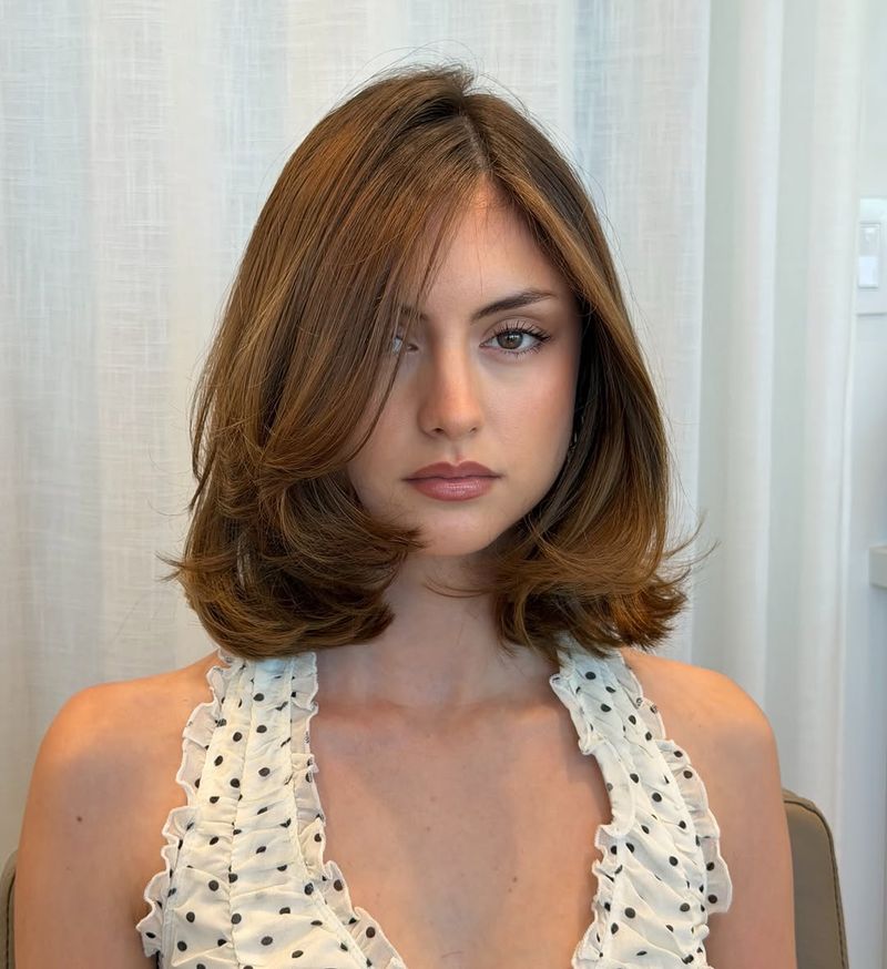 23. Blowout Layered Bob with Sweeping Fringe