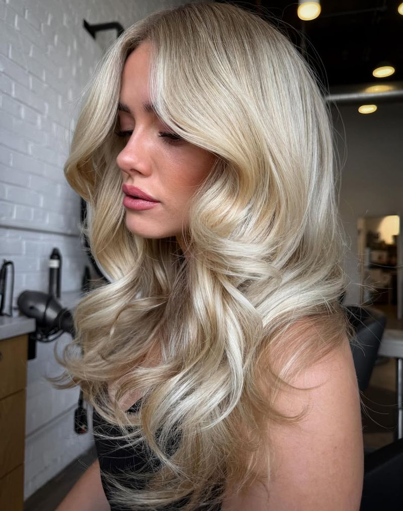 10. Bombshell Blowout with Curtain Bangs