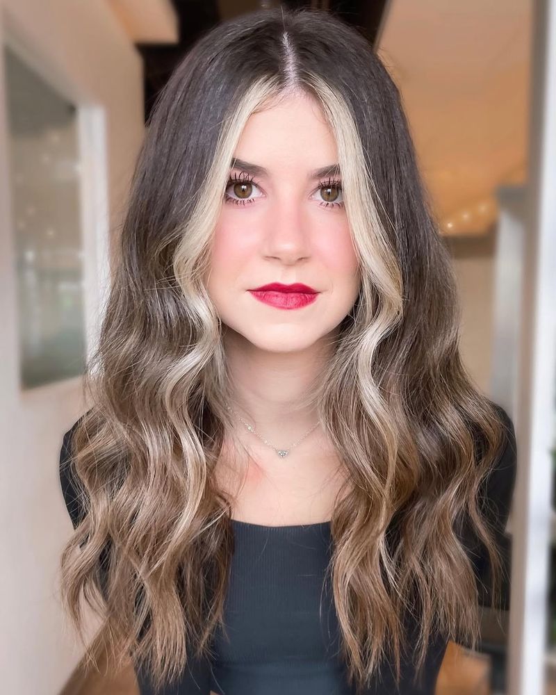 16. Bright Blonde Face-Framing Streaks on Dark Brown Hair