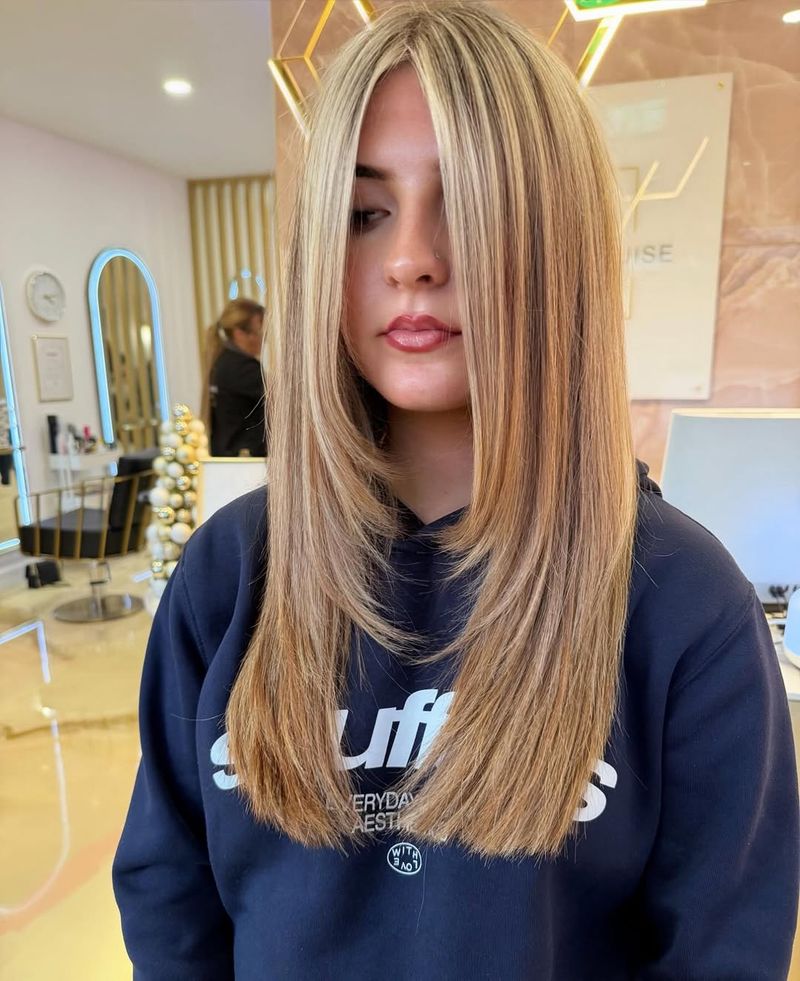 6. Bright Blonde Money Piece with Long Cascading Layers