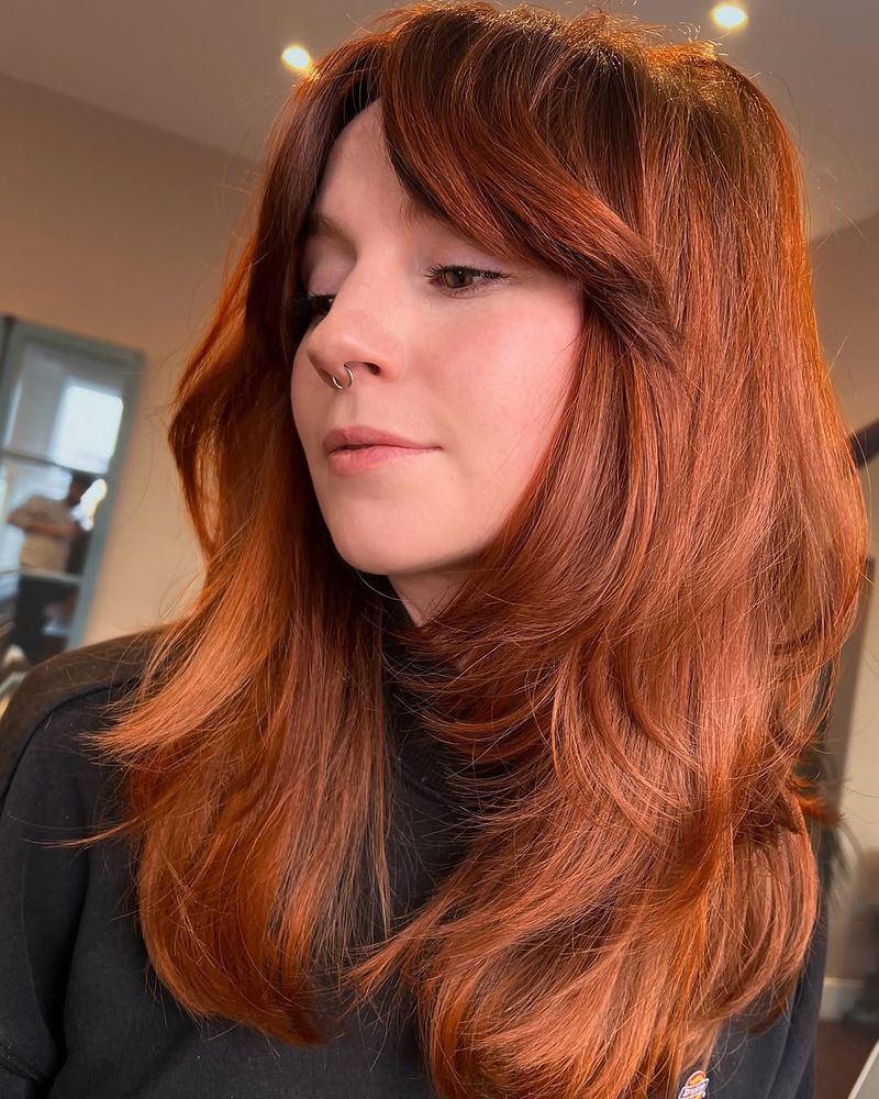 23. Bronzed Auburn Blowout with Curtain Bangs