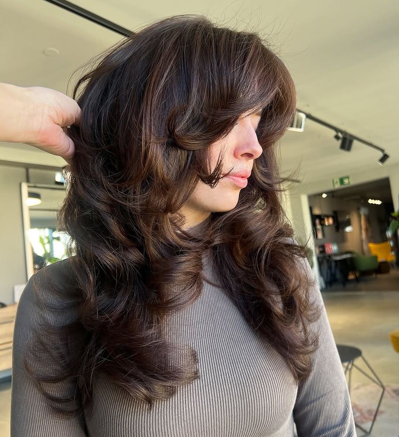 5. Brunette Butterfly Shag with Curtain Bangs
