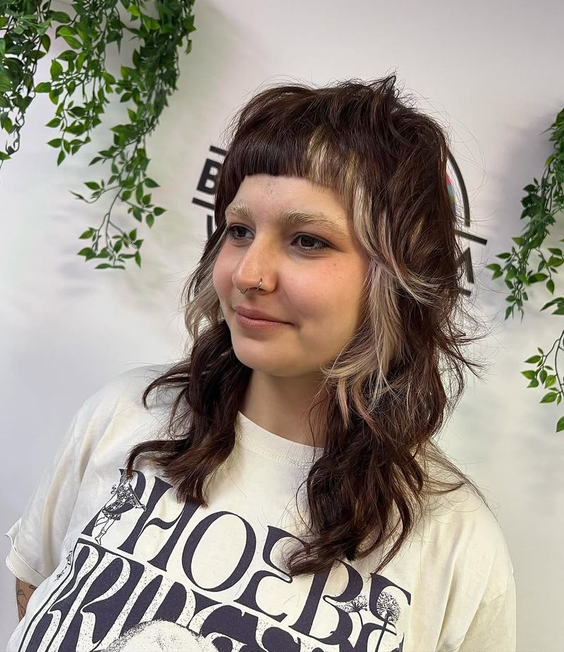 40. Brunette Shag with Blonde Money Pieces and Micro Bangs