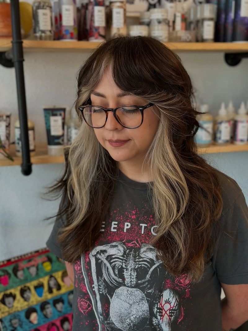 20. Brunette Shag with Creamy Platinum Face-Framing Streaks