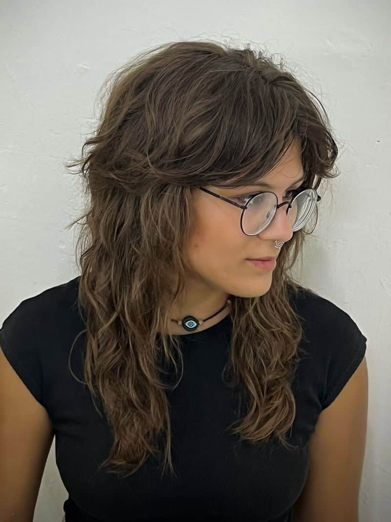 9. Brunette Shag with Full Brow-Grazing Fringe