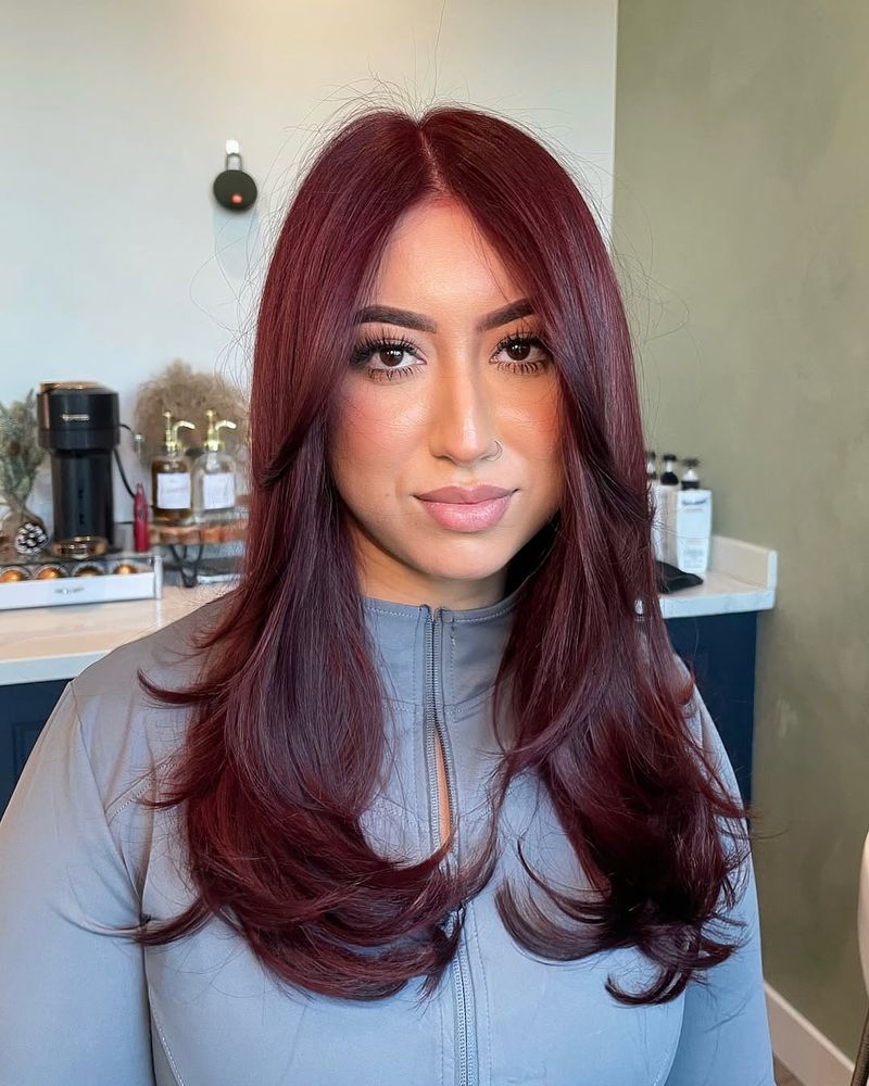 9. Burgundy Layers with Curtain Bangs