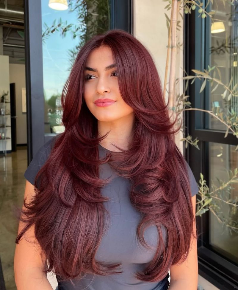 24. Burgundy Layers with Curtain Bangs