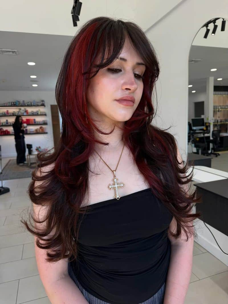 19. Burgundy Red Velvet Layers with Face-Framing Fringe