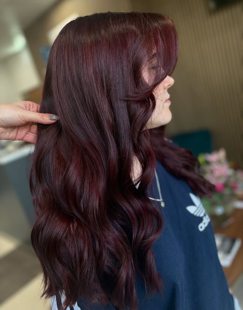20. Burgundy Waves with Curtain Bangs