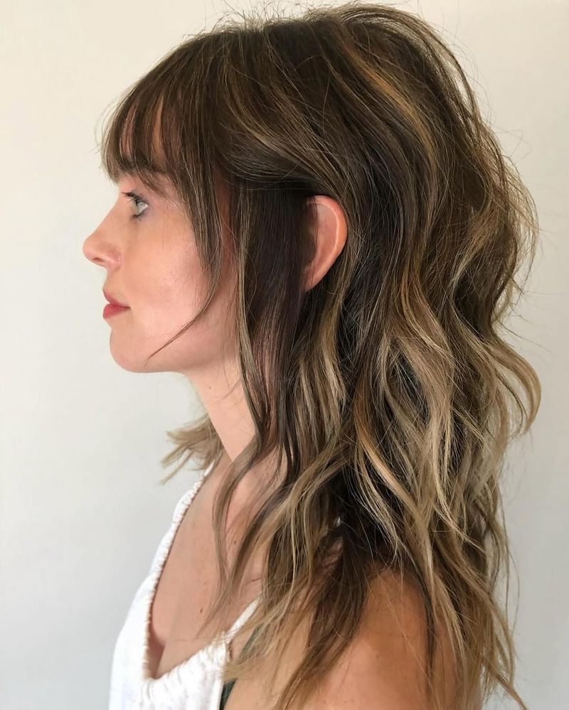 42. Caramel Balayage Shag with Soft Fringe