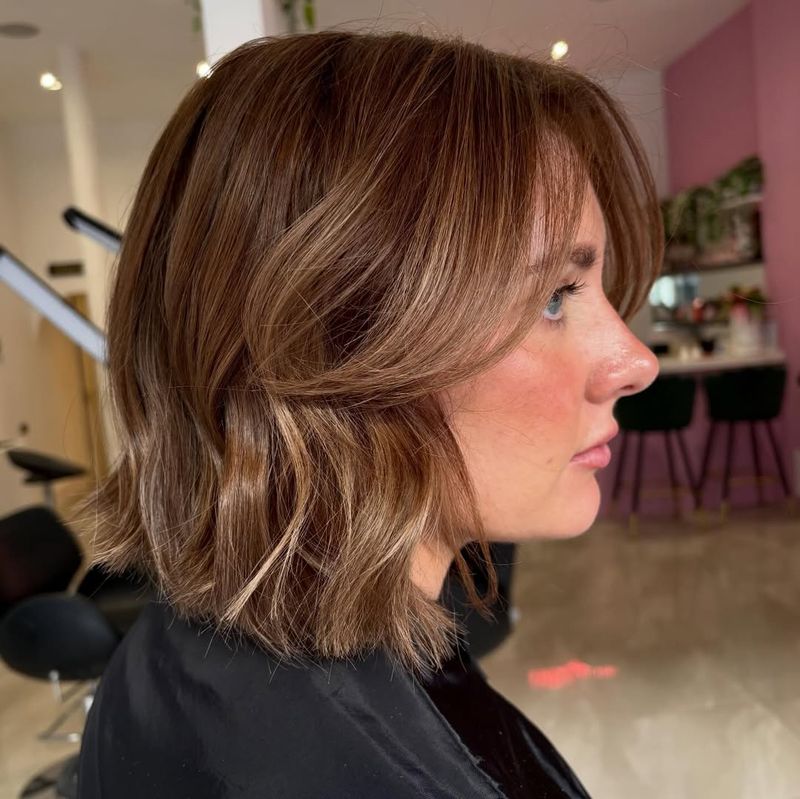 54. Caramel Bob with Curtain Bangs