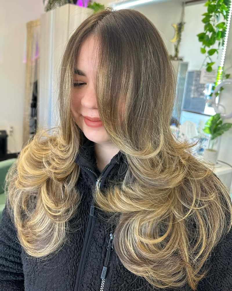 23. Caramel Butterfly Layers with Curtain Bangs