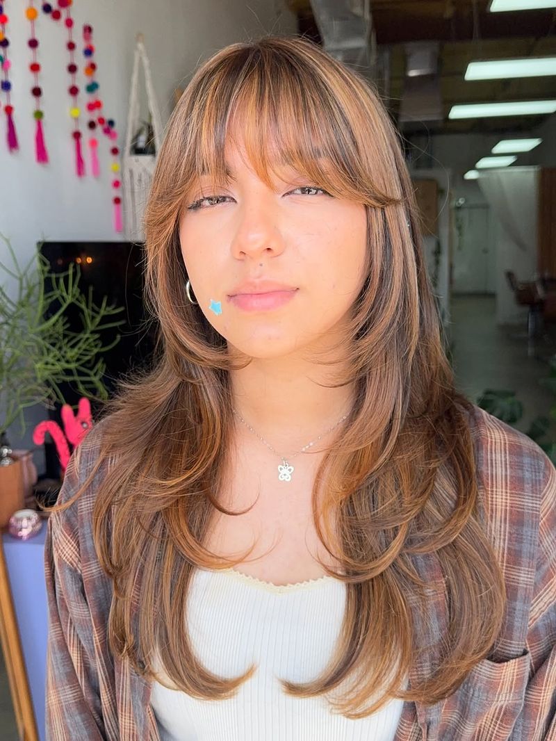 27. Caramel Butterfly Layers with Wispy Bangs