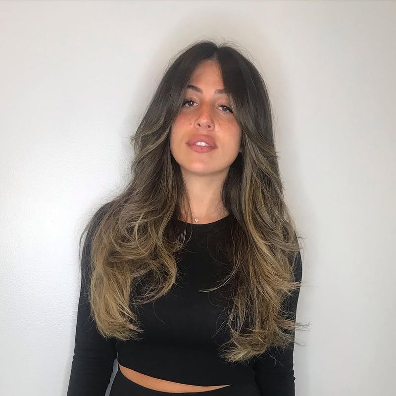 10. Caramel Highlights with Curtain Bangs