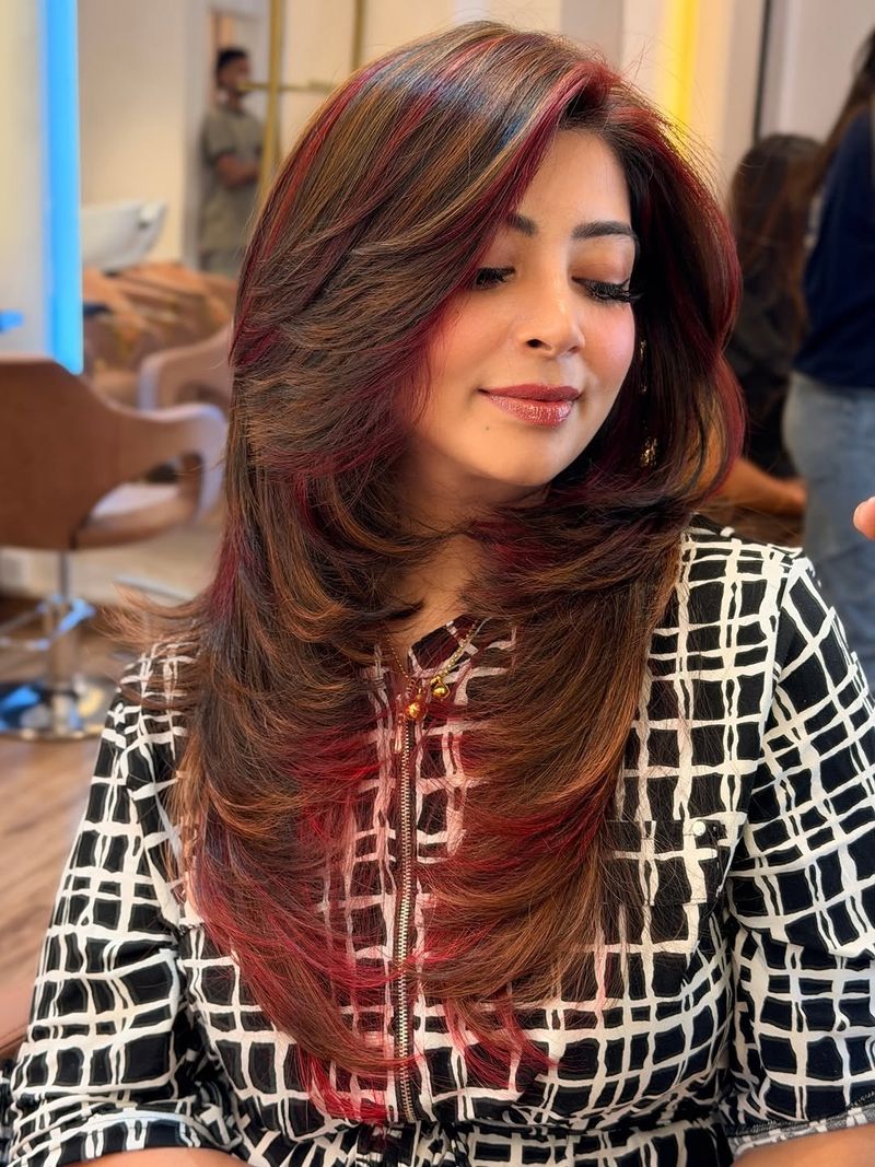 1. Caramel Layers with Burgundy Peekaboo Streaks