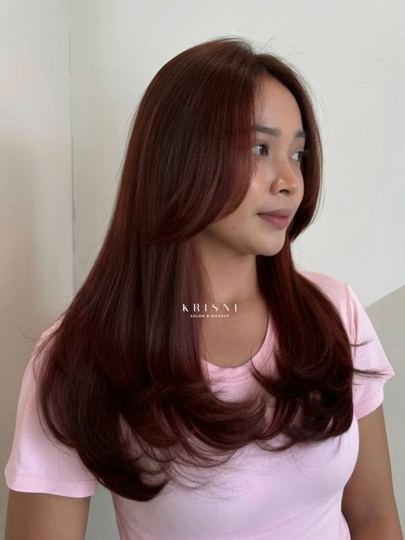 28. Cascading Blowout Layers with Soft Burgundy Tones