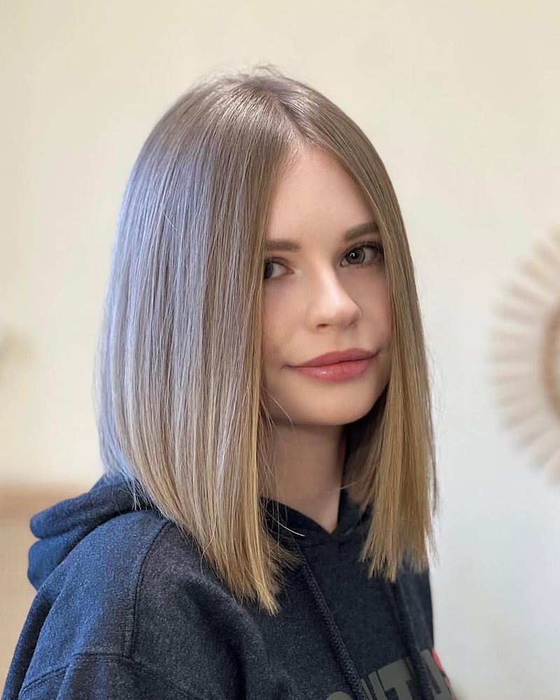 16. Center-Parted Ash Blonde Lob
