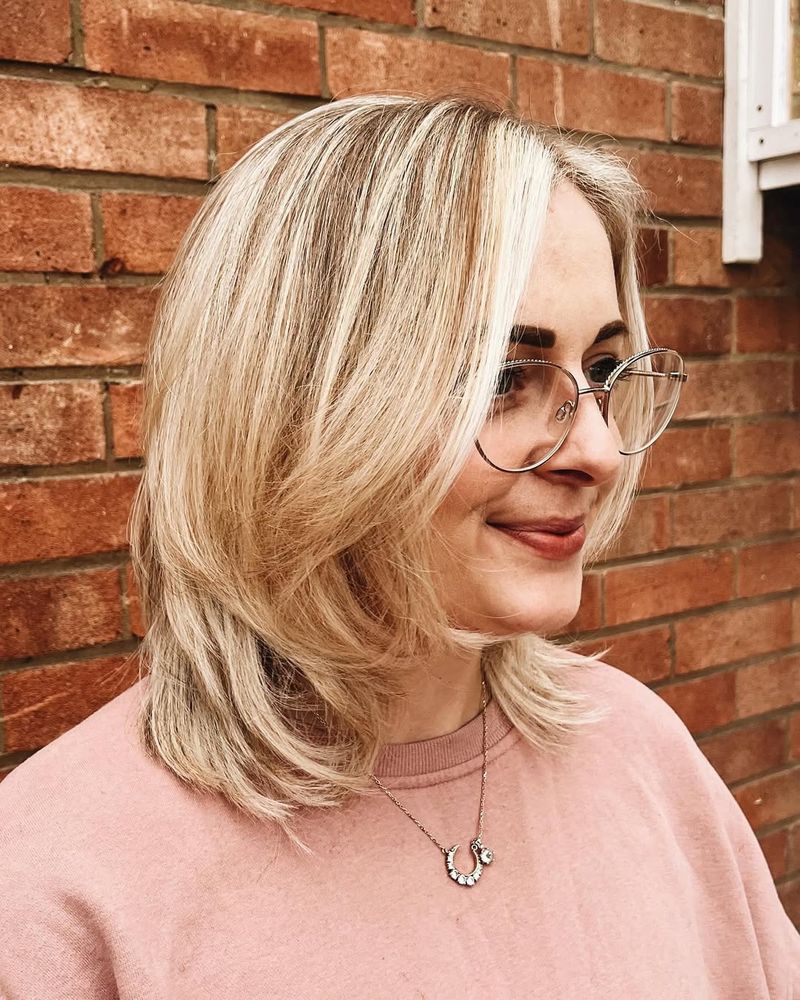 35. Collarbone Length Blonde Lob with Soft Face-Framing Layers