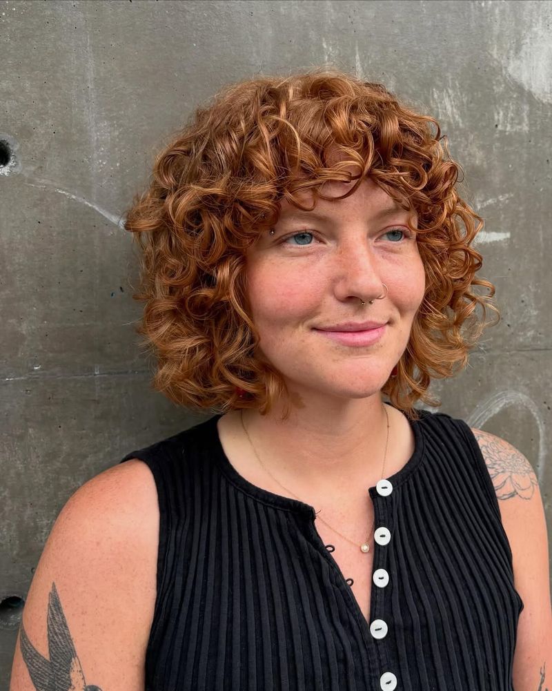 9. Copper Curls with Soft Bangs