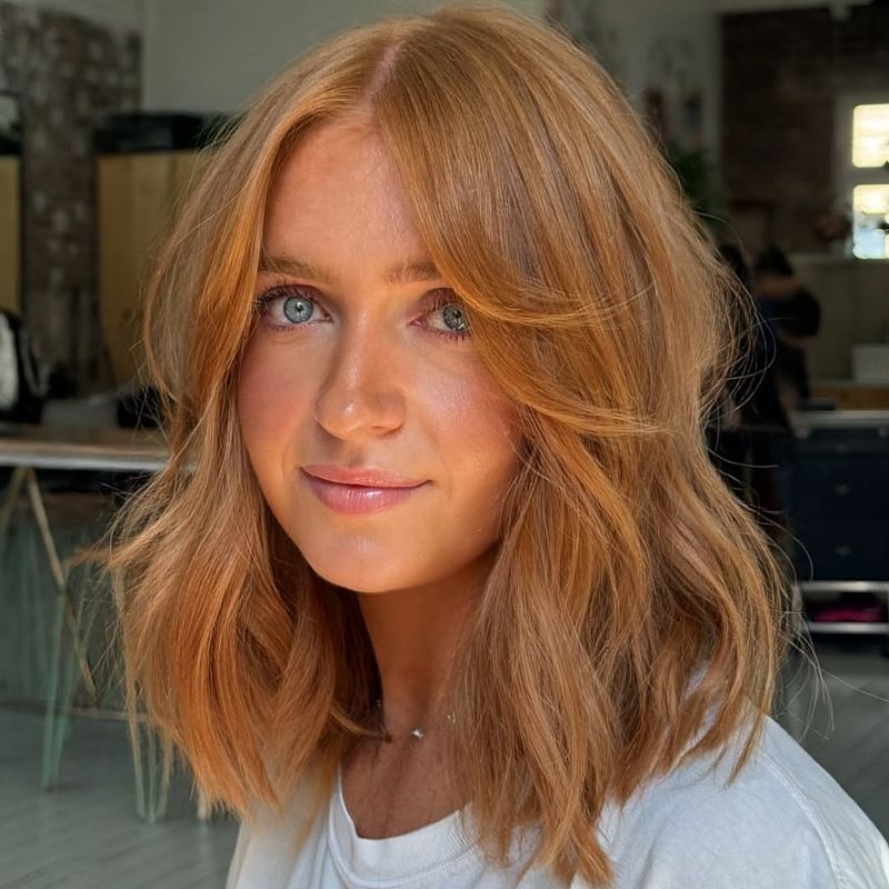 18. Copper Lob with Curtain Bangs